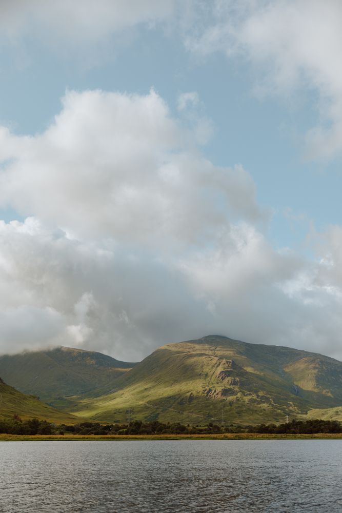Picturesque view of hills and cloudy sky