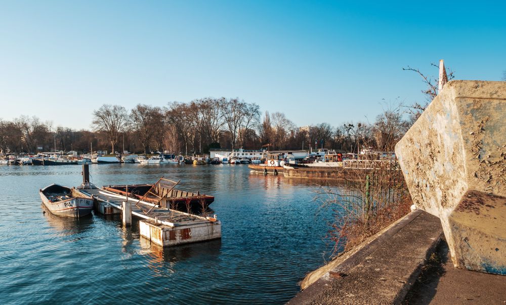 Old port, abandoned buildings, bridges, graffiti on the walls of houses in Strasbourg