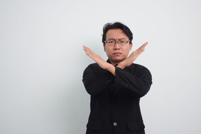 Asian Businessman gesturing no