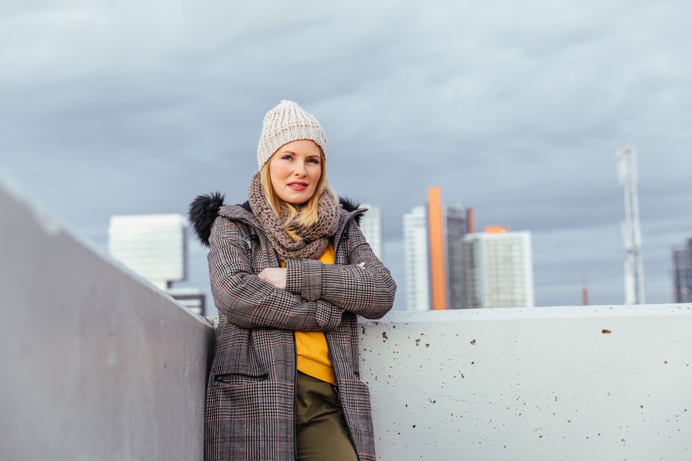 Portrait of blonde woman posing in the city