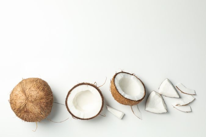 Flat lay with coconut on plain background, top view