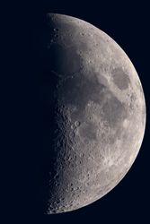 Detailed view of waxing gibbous moon showing cratered surface.
