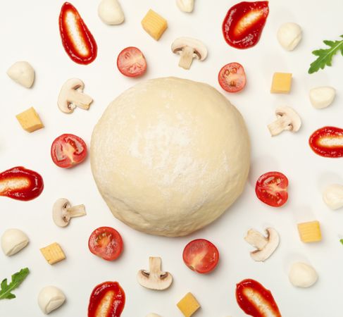 Ingredients for cooking pizza and dough on blank background