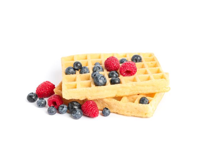 Belgian waffles with berries isolated on blank background