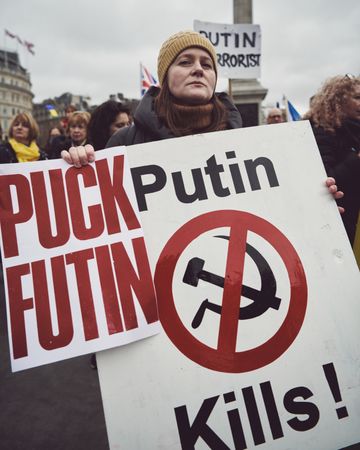 London, England, United Kingdom - March 5 2022: Woman with anti Putin sign in Trafalgar Square