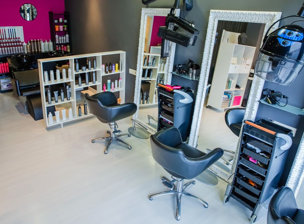 Empty hair salon with pink wall