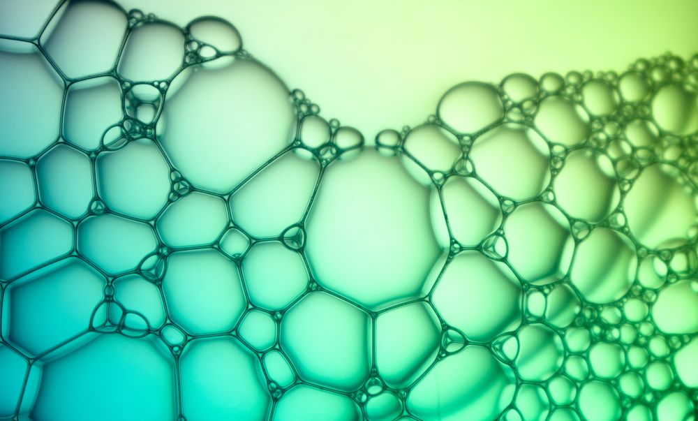 Abstract background bio technology, macro photography foam and water with gradient background. Molecule multicolor backgorund