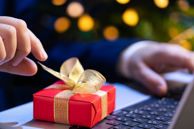 Businessman Reaching for Christmas Gift