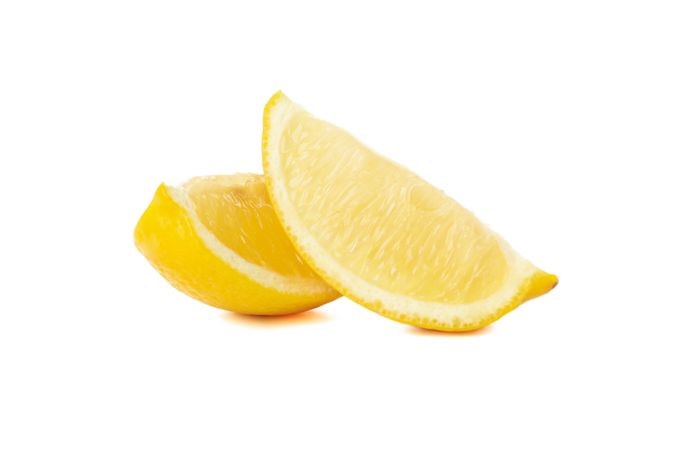 Lemon slices isolated on light background. Ripe fruit