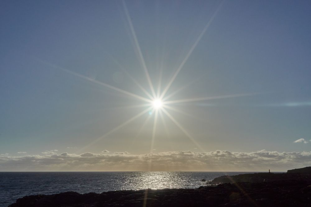 Sun shining over ocean