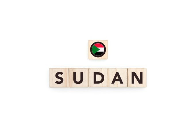 Wooden blocks bearing the name and flag of Sudan.