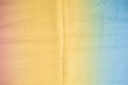 Gradient yellow blue pink and green fabric  background texture.