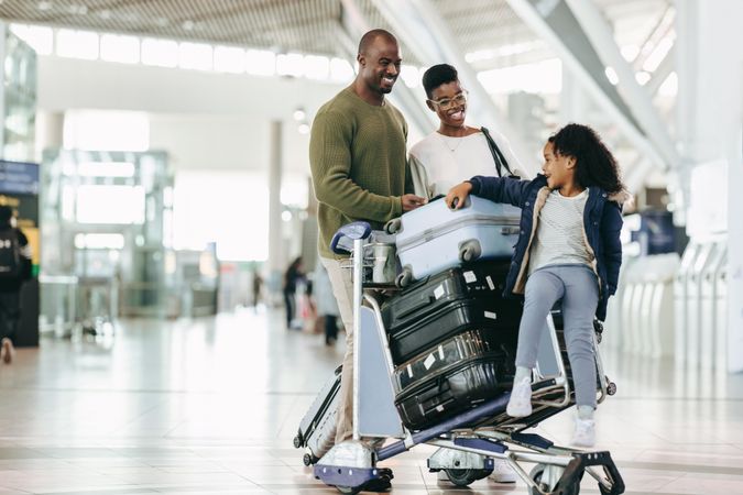 Black family waiting at airport for their flight