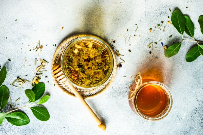 Top view of herbal tea with honey and branches