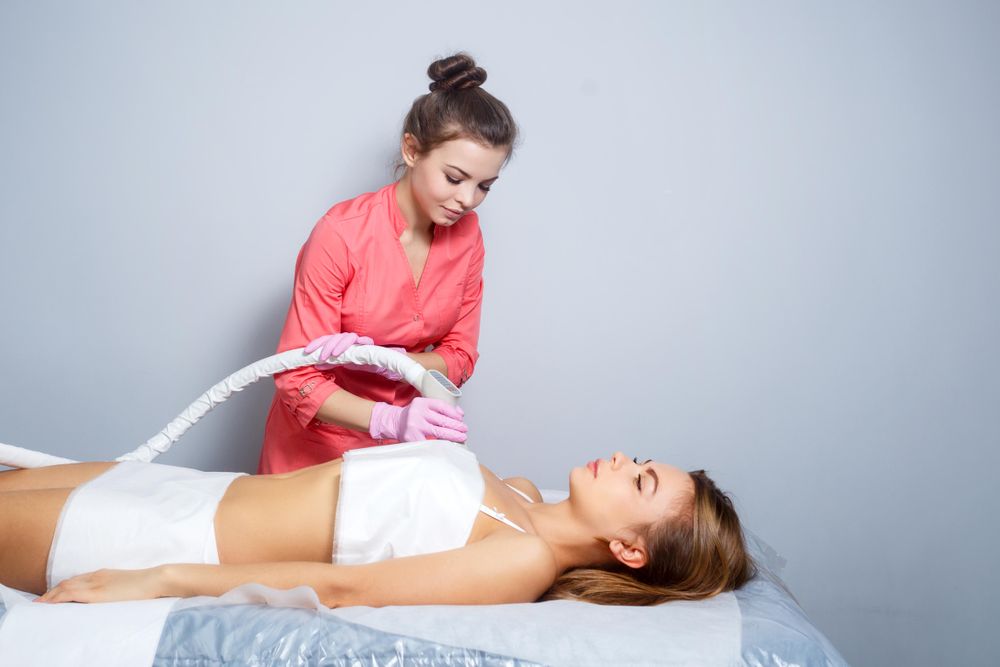 Cosmetologist doing beauty treatment on client