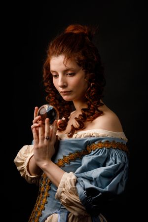 Baroque woman with glass ball