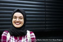 Happy woman in hijab and glasses 4ZQV35