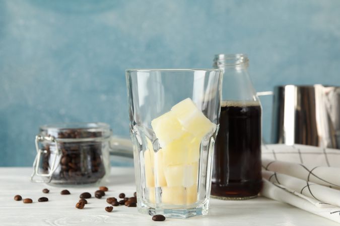 Composition with ice coffee on wooden background