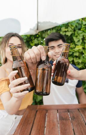 Group of friends drinking beer on the terrace of a bar