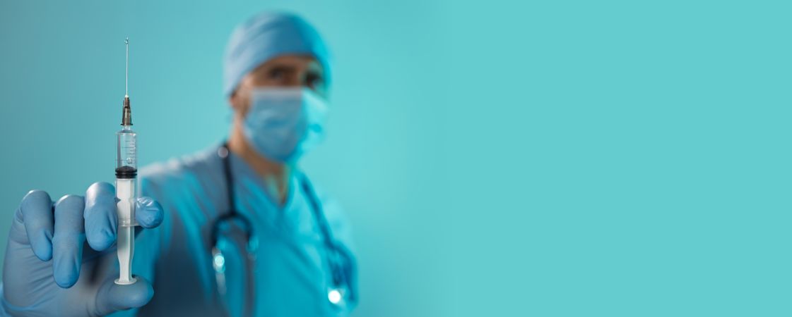 Doctor Holding Syringe Medical Banner
