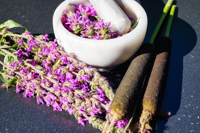 Purple flowers in ceramic bowl