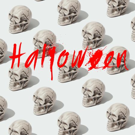 Row of skulls on light background with “Halloween” text