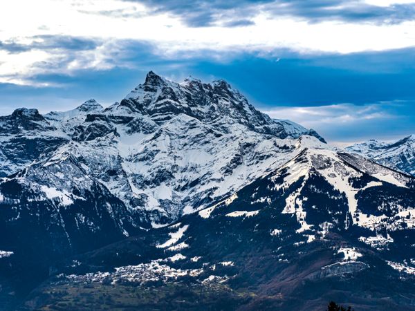 Swiss Alps winter landscape with snow and sun, mountains in Europe