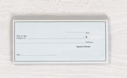 Blank checkbook on desktop