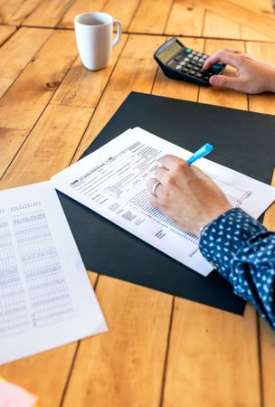 Male taxpayer filling in individual income tax return