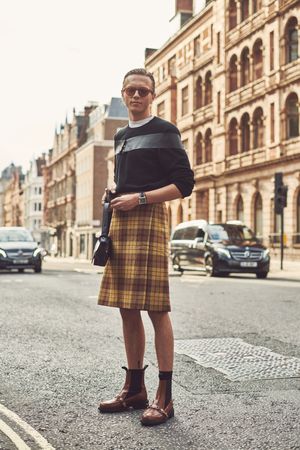 London, England, United Kingdom - September 18 2021: Man wearing a plaid skirt on a London street