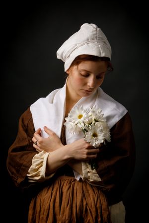 Medieval maid holding flowers