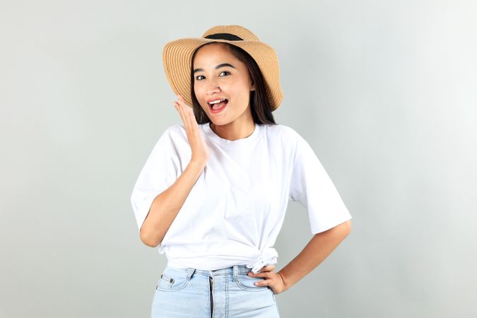 Happy Asian Woman in Summer Casual Clothes and Beach Hat