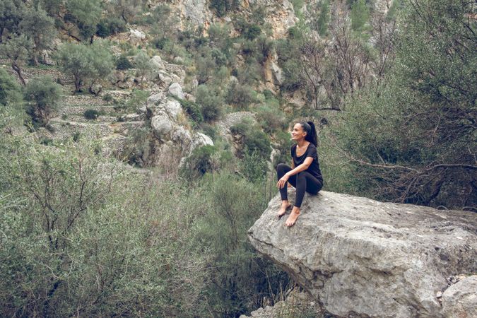 Glad female tourist admiring highlands