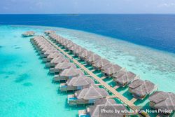 Two rows of overwater bungalows in the Maldives 0yNKL5