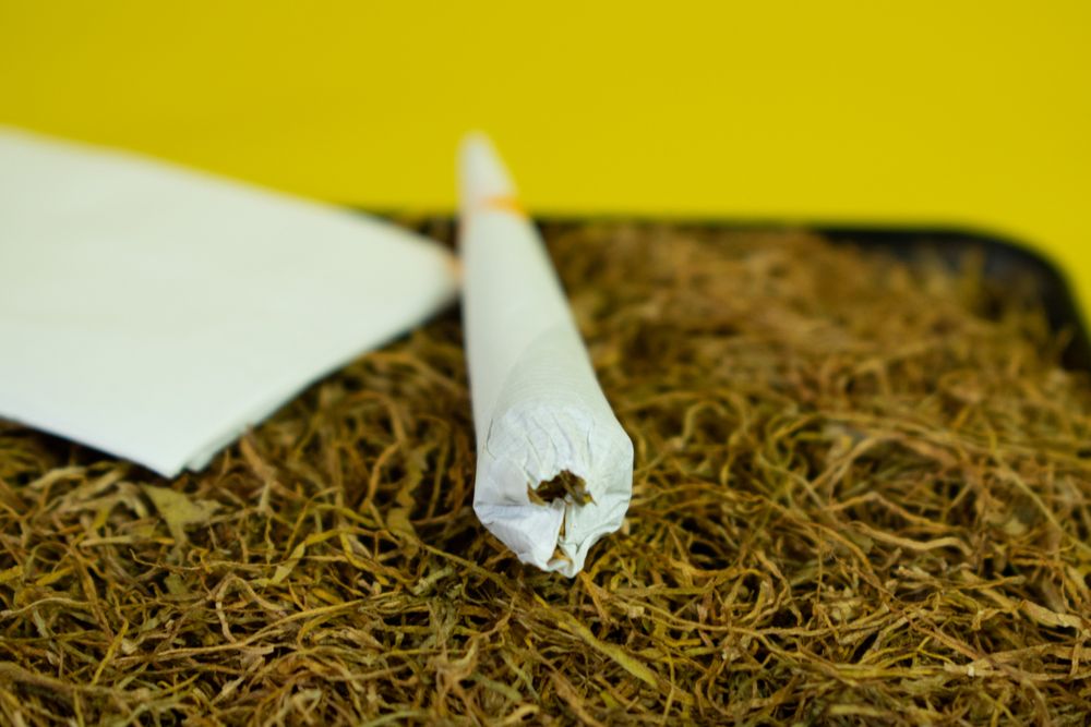 Rolled cigarette on loose tobacco