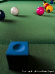 Blue pool chalk on billiard table 5oyrxb