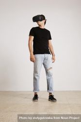 Man standing wearing VR headset 5q1KJ5