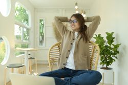 Woman relaxing in the living room at home.