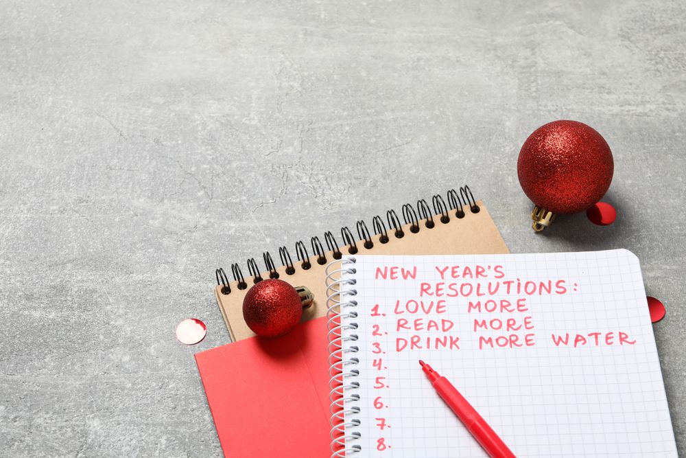 Envelope, notepad with list and balls on gray background, space for text