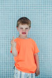 Cheerful playful boy showing sign of rock