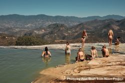 Group of woman bathing in fresh mountain spring 4dxja4