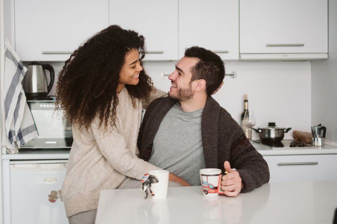 Multiethnic couple in modern kitchen