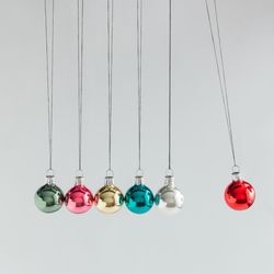 Colorful Christmas baubles decoration, on light background with copy space