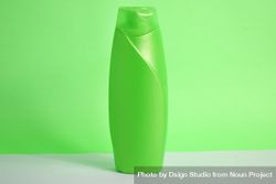 Green body wash bottle without labels on counter in green room 0gXXrN
