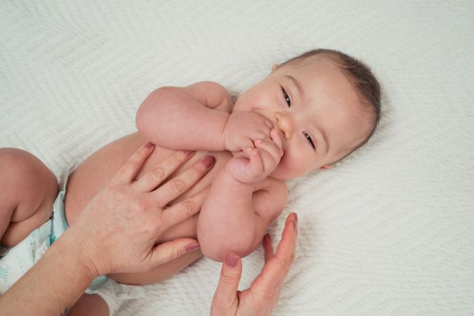 Portrait of cute baby boy with Down syndrome