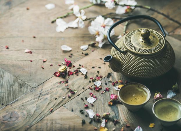 Oriental teapot and teacups on table with copy space