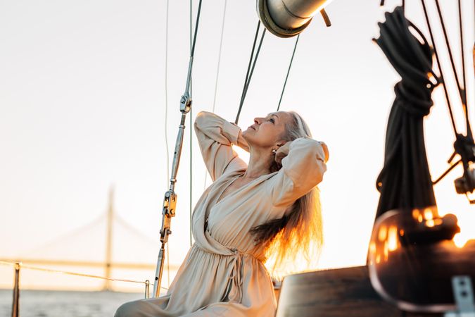 Older woman with her hair back on a sailboat