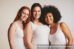 Group of diverse models wearing tank tops against light colored background 5p9Wv4