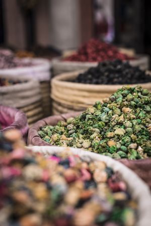 Baskets with dried spices on marketplace