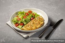 Omelet with cheese and lettuce and tomato salad. 5ngxXZ